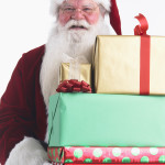 Santa Claus with Armload of Presents --- Image by © Royalty-Free/Corbis